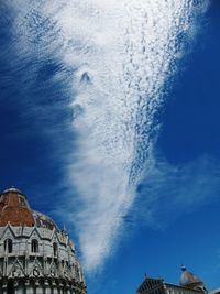 Low angle view of built structure against blue sky