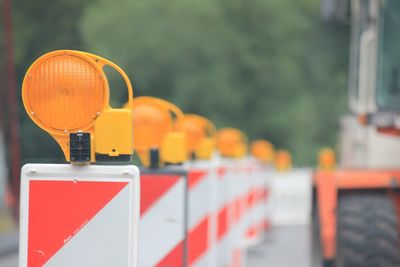 Close-up of orange traffic cones in row