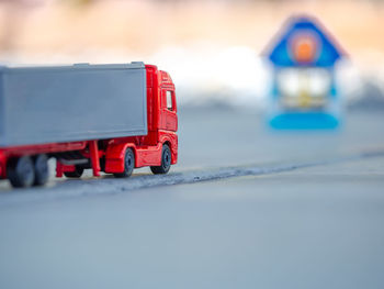 Close-up of toy car on road during winter