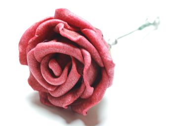 Close-up of red rose against white background