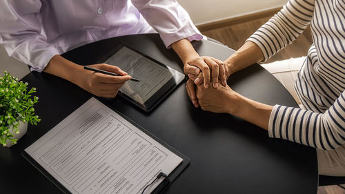 High angle view of people on table