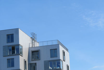 Low angle view of building against blue sky