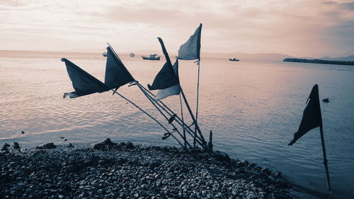 Scenic view of beach against sky during sunset