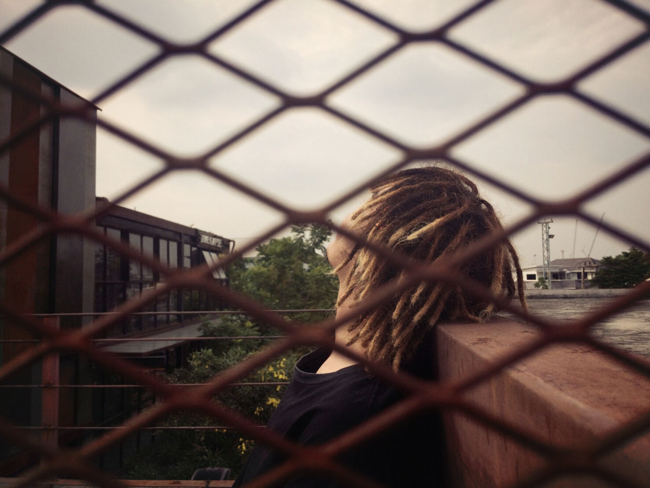 real people, one person, built structure, day, building exterior, architecture, lifestyles, headshot, outdoors, medium-length hair, young adult, people