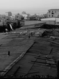 View of sea and cityscape against sky