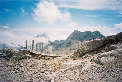 Panoramic view of bridge and mountains against sky