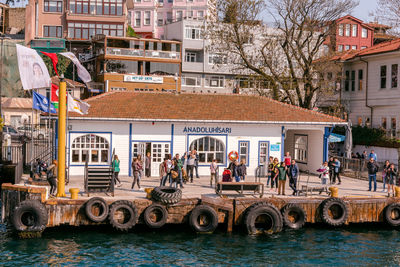 People in city against buildings