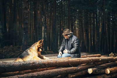 Man with dog in the forest