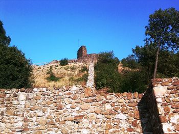 Low angle view of castle against blue sky