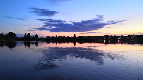 Scenic view of lake against sky during sunset