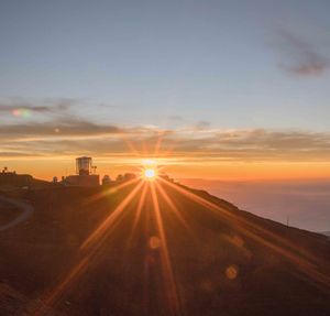 Scenic view of sunset over city