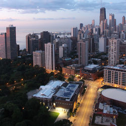 High angle view of buildings in city against sky