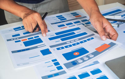 High angle view of person hand on table