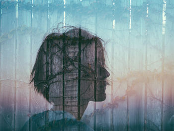 Digital composite image of woman seen through glass window