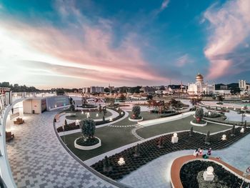 High angle view of swimming pool in city against sky