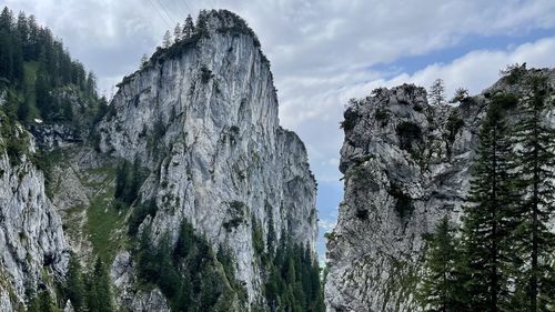 Panoramic view of rocks and trees against sky