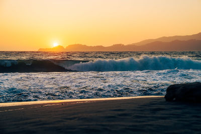 Scenic view of sea against sky during sunset