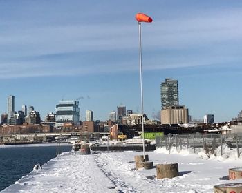 Scenic view of city against sky during winter