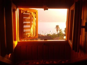 View of sea through window