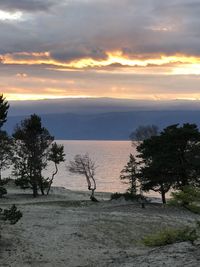 Scenic view of landscape against sky during sunset