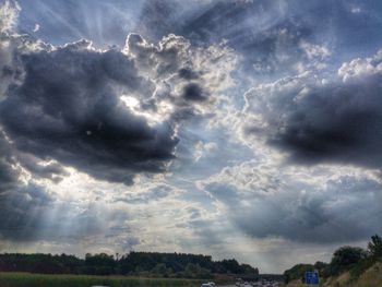 Scenic view of storm clouds over landscape