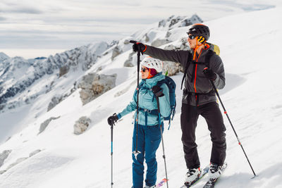 Full length of man skiing on snow covered mountain