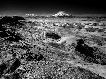 Aerial view of volcanic landscape against sky