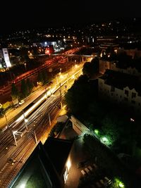 High angle view of light trails on road in city