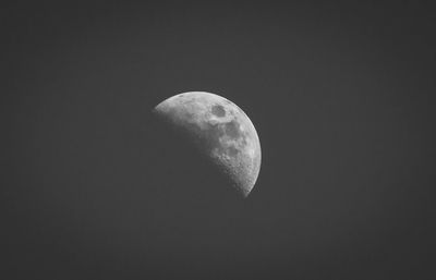 Low angle view of moon against sky at night