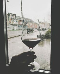 Close-up of wine glasses against sky