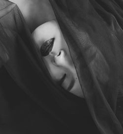 Close-up of woman with face covered by veil