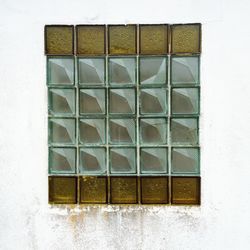 Metal grate against white wall