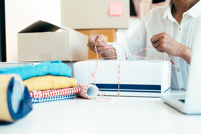 Midsection of businesswoman working in office