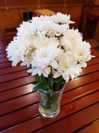 Close-up of white flower vase on table