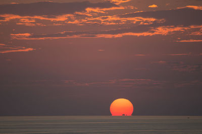 Scenic view of landscape against sky at sunset