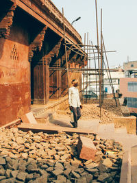 Rear view of man working at construction site