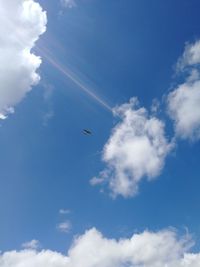 Low angle view of airplane flying in sky