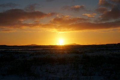 Scenic view of landscape against sky during sunset