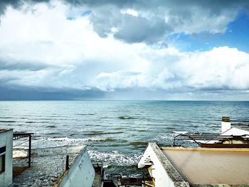 Scenic view of sea against cloudy sky