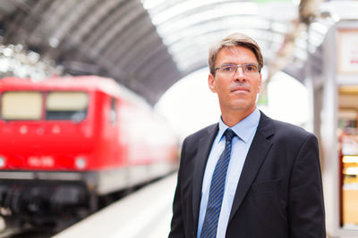 Portrait of man standing in bus