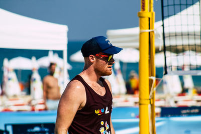 Young man looking at swimming pool