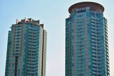 Low angle view of modern buildings against sky