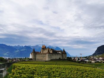 Historic building against cloudy sky