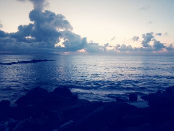 Scenic view of sea against sky at sunset