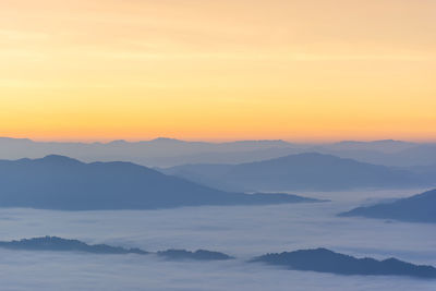 Scenic view of mountains against sky during sunset