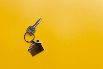 Close-up of metal against yellow background