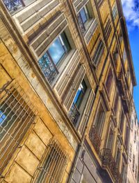 Low angle view of building against blue sky