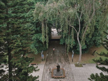 High angle view of statue amidst footpath at park