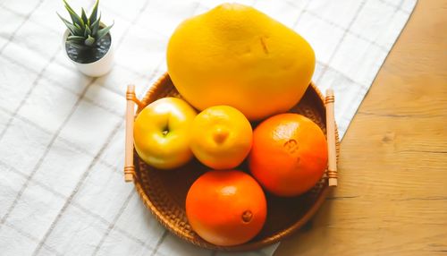 High angle view of fruits in basket on table