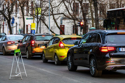 Vehicles on road along buildings